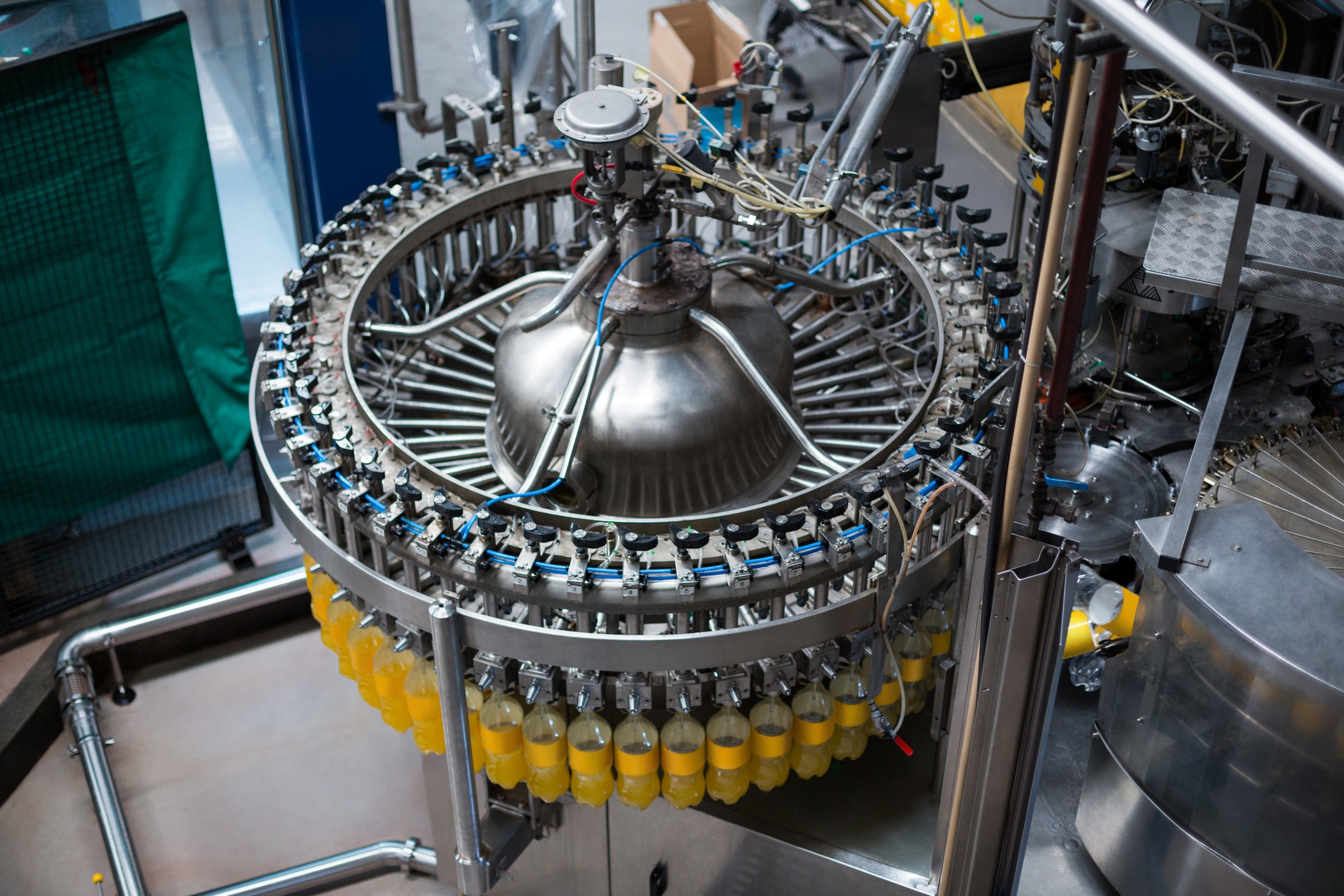 Bottles being filled with juice on production line
